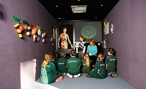 Children from Albion Park Public discuss the human body in the Life Education van at the school. 