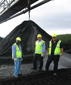 Mike O’Connell, Modher Barakat and Alex Padya in front of the stockpile of attritioned concentrate.  