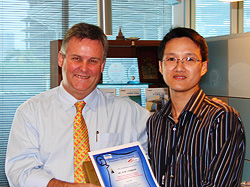 Peter Wilson, President BlueScope Thailand, presenting Artit Chaipanit with an inaugural safety award.